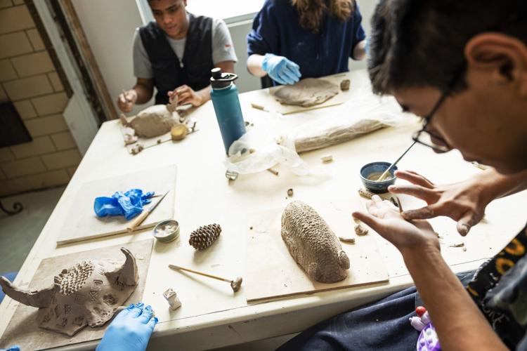 Neurodivergent students learn ceramics in art workshop