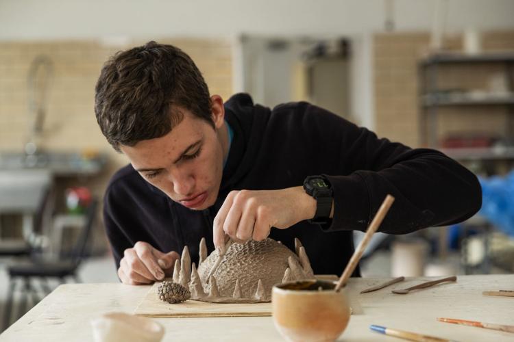 Neurodivergent students learn ceramics in art workshop